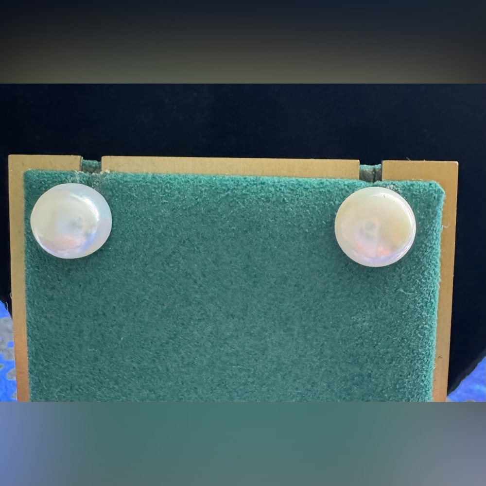 11 mm Fresh Water Pearl in non tarnish micron setting.